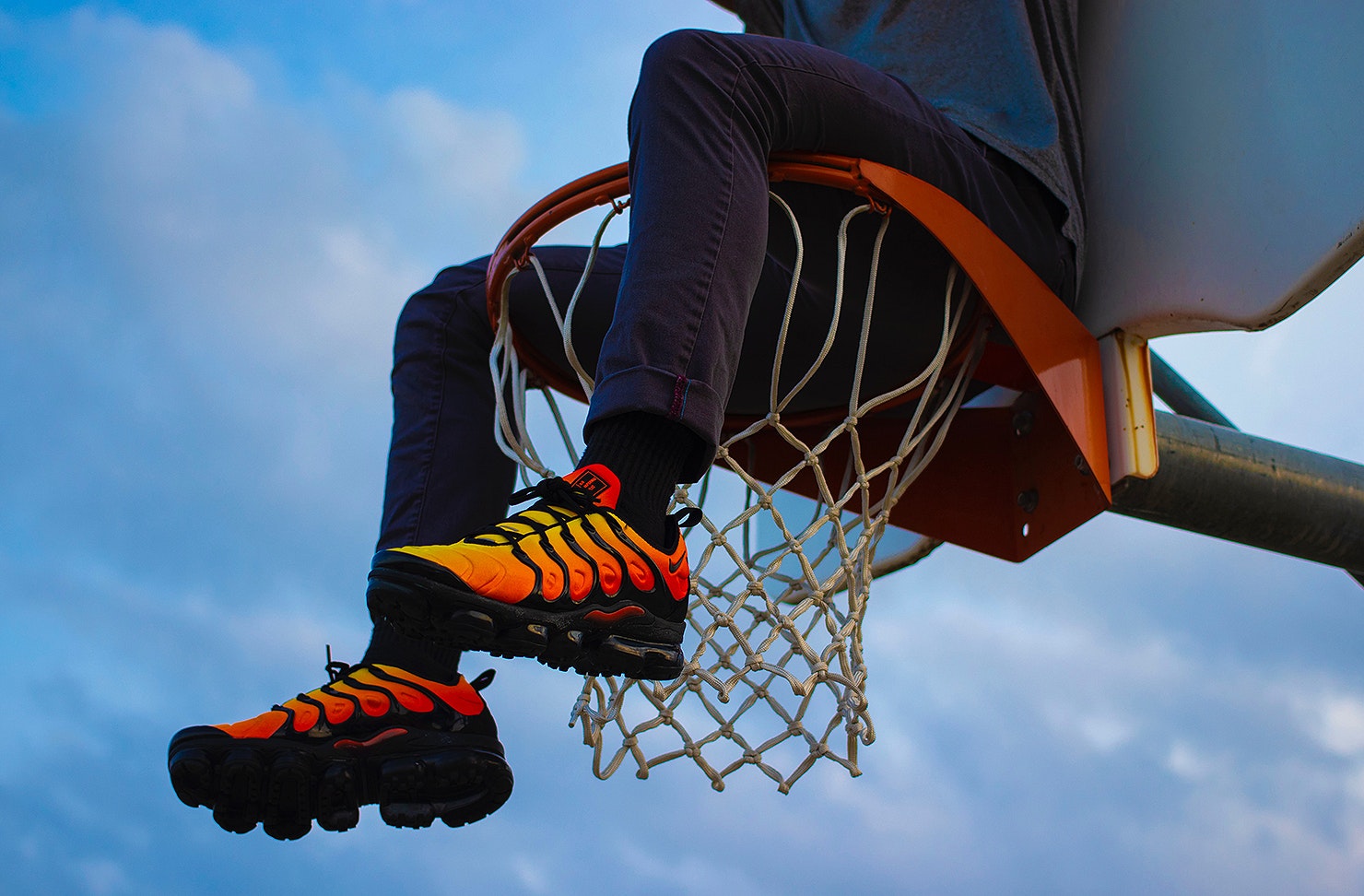 Guy wearing cool sneakers on basketball court